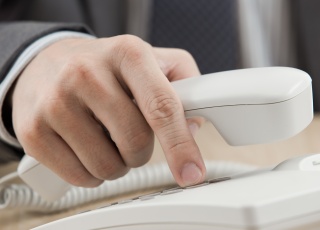 Man dialing telephone (photo)